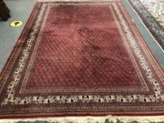 An Indian carpet of Persian Serabend design,