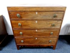 A George III inlaid mahogany four drawer chest,