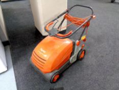 A Flymo Lawnrake compact 340 with lead