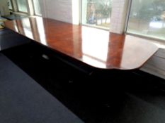 A reproduction Regency style twin pedestal dining table with two leaves,