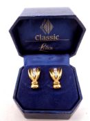 A pair of Lotus gold plated earrings