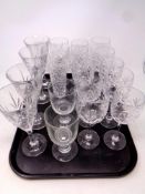 A tray containing assorted drinking glasses to include wine glasses,