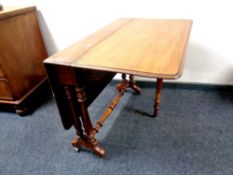 A 19th century mahogany drop leaf table