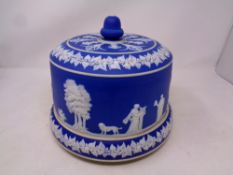 A blue and white antique Jasperware cheese dish and cover