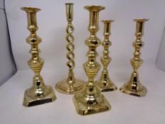 Five antique brass candlesticks