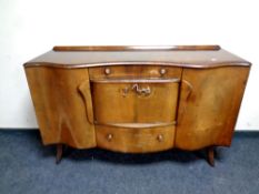 A mid century walnut veneered sideboard,