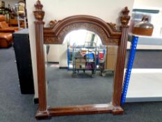 A contemporary bevelled mirror with pillared sides, width 104 cm,