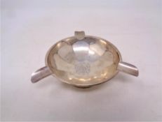 A loaded silver ashtray, Birmingham marks, diameter 13cm.