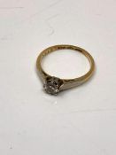 An 18ct gold and platinum diamond solitaire ring, size K.
