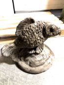 A concrete garden figure of a fish