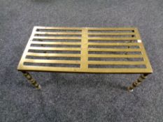 A brass fireside stand