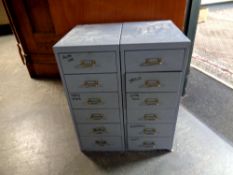 A pair of metal six drawer chests