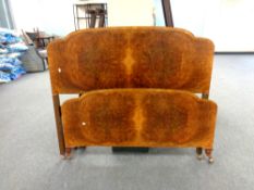 A 1920s walnut 4ft 6' bedstead with metal rails