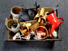 A box containing decorative glass vases,