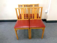 Four beech chapel chairs,