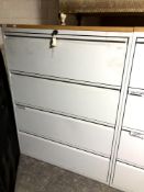 A four drawer metal document cabinet