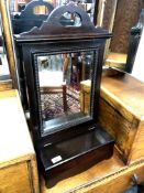 An Edwardian mahogany mirror with storage compartment,