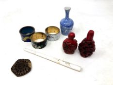 A tray of oriental wares including three cloisonne napkin rings, small baluster vase,
