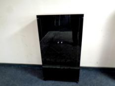 A high gloss fold out double door storage cabinet,
