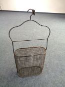 A vintage wire hanging crate