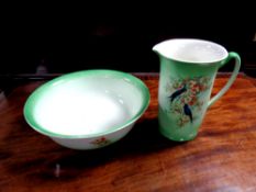 A Staffordshire transfer printed jug and basin with panels of birds on branch
