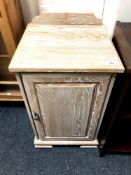 A washed pine effect pot cupboard