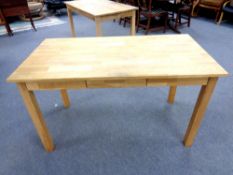 A contemporary oak office table fitted three drawers,