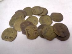 A bag containing eighteen vintage transport tokens
