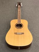 An SX Custom Guitars six-string acoustic guitar, model number DG50, serial number 8400390,