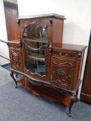 A Victorian mahogany chiffoniere on cabriole legs