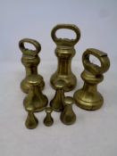 Eight 19th century brass weights