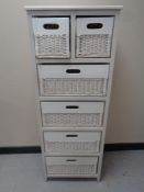 A wood and wicker six drawer chest