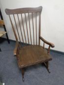 A spindle back rocking chair