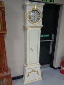 A continental painted longcase clock with circular dial