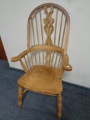 A pine Windsor kitchen armchair
