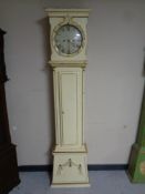 A continental painted longcase clock with circular dial