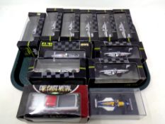 A tray containing eleven die cast Formula 1 cars together with a collector's edition,