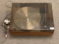 A Linn Sondek LP 12 turntable, with smoked perspex cover (complete with support arm),