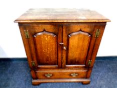 A Titchmarsh and Goodwin Georgian style cabinet fitted a drawer