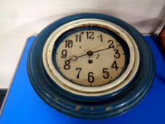 An antique circular painted cased wall clock