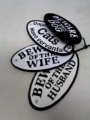 Four cast iron warning plaques