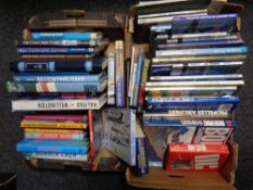 Two boxes containing approximately 50 hardback and softback books relating to aviation
