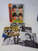 A basket containing books and scrapbooks relating to the Beatles