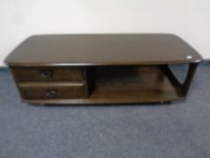 An Ercol Windsor Minerva coffee table in an antique finish