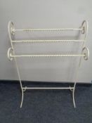 A wrought iron towel rail
