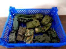 A crate containing mid 20th century Dinky die cast military vehicles