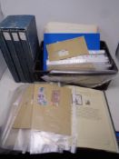 A crate containing stamp albums,