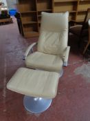 A late 20th century Scandinavian metal framed armchair upholstered in a cream leather together with