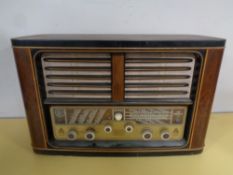 A 20th century Eltra walnut cased Air Empress 953 valve radio