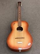 A Eko six-string acoustic guitar, serial number 87154.